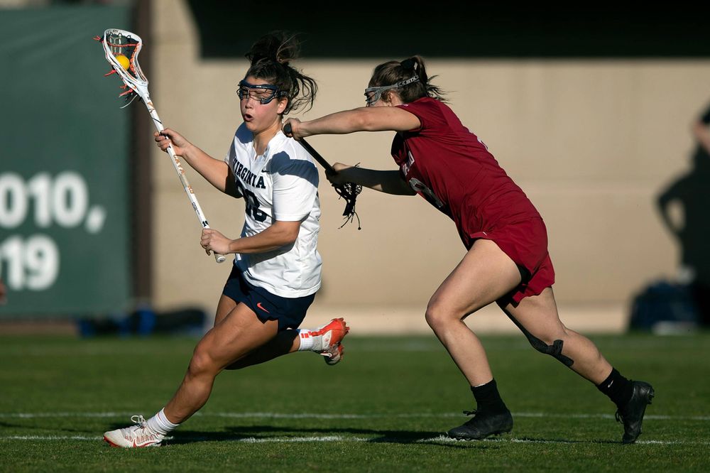 STANFORD, California - FEBRUARY 14: Virginia Cavaliers midfield Kiki Shaw (23) is defended by Stanford Cardinal defense Kyra Pelton (8) during the first half at Cagan Stadium on February 14, 2020 in Stanford, California. The Virginia Cavaliers defeated the Stanford Cardinal 12-11. (Photo by Jason O. Watson)