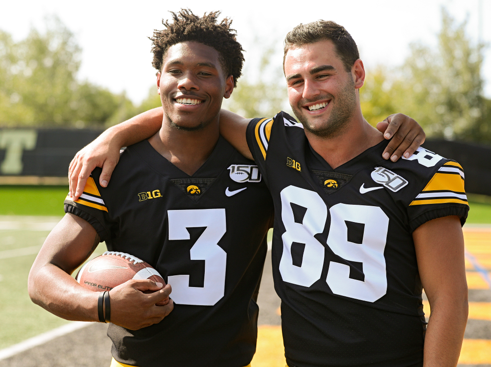 Iowa Hawkeyes wide receiver Tyrone Tracy Jr. (3) and wide receiver Nico Ragaini (89 pose for a photo during Iowa Football Media Day at the Hansen Football Performance Center in Iowa City on Friday, Aug 9, 2019. (Stephen Mally/hawkeyesports.com)