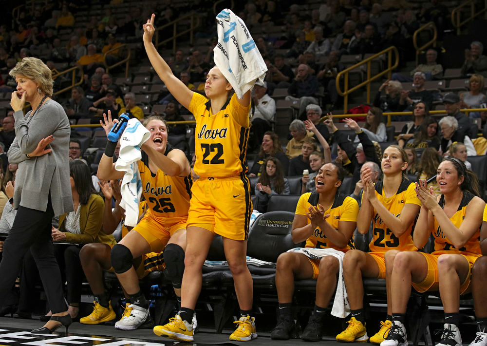 Iowa forward/center Monika Czinano (25) and guard Kathleen Doyle (22) celebrate after guard Makenzie Meyer (not pictured) made a 3-pointer during the fourth quarter of their game against Winona State at Carver-Hawkeye Arena in Iowa City on Sunday, Nov 3, 2019. (Stephen Mally/hawkeyesports.com)