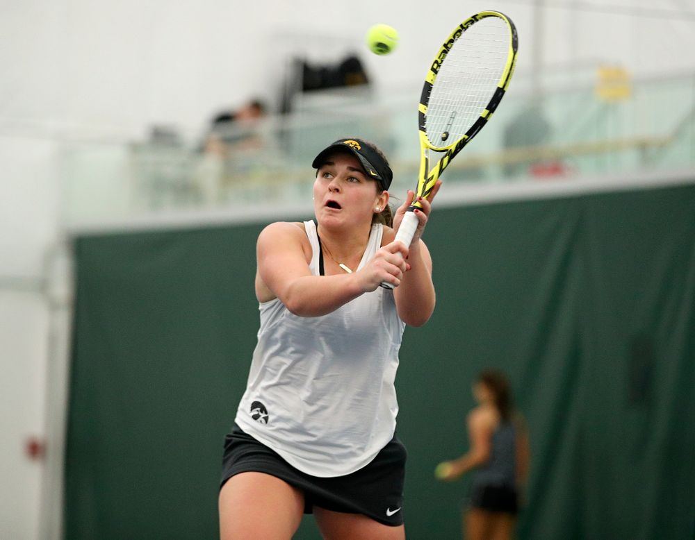 Iowa’s Danielle Bauers returns a shot during her singles match at the Hawkeye Tennis and Recreation Complex in Iowa City on Sunday, February 23, 2020. (Stephen Mally/hawkeyesports.com)