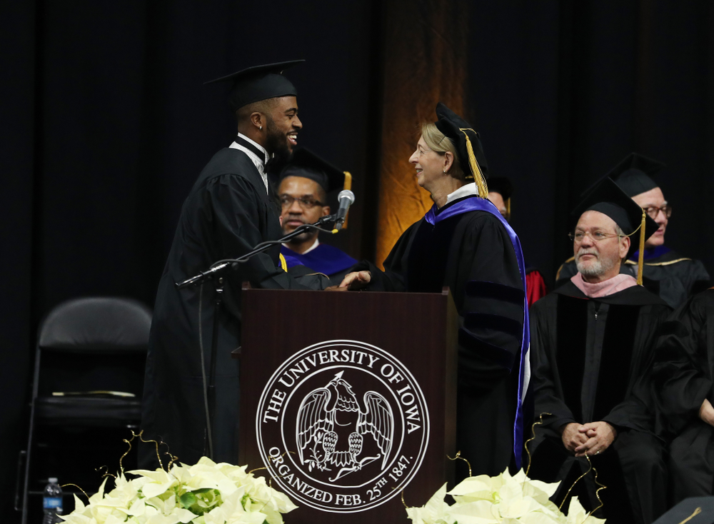 Iowa Track's Christian Brissett during the Fall Commencement Ceremony Saturday, December 15, 2018 at Carver-Hawkeye Arena. (Brian Ray/hawkeyesports.com)