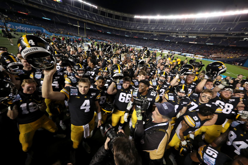 The Iowa Hawkeyes sing the Fight Song after their win against USC in the Holiday Bowl Friday, December 27, 2019 at San Diego Community Credit Union Stadium. (Brian Ray/hawkeyesports.com)