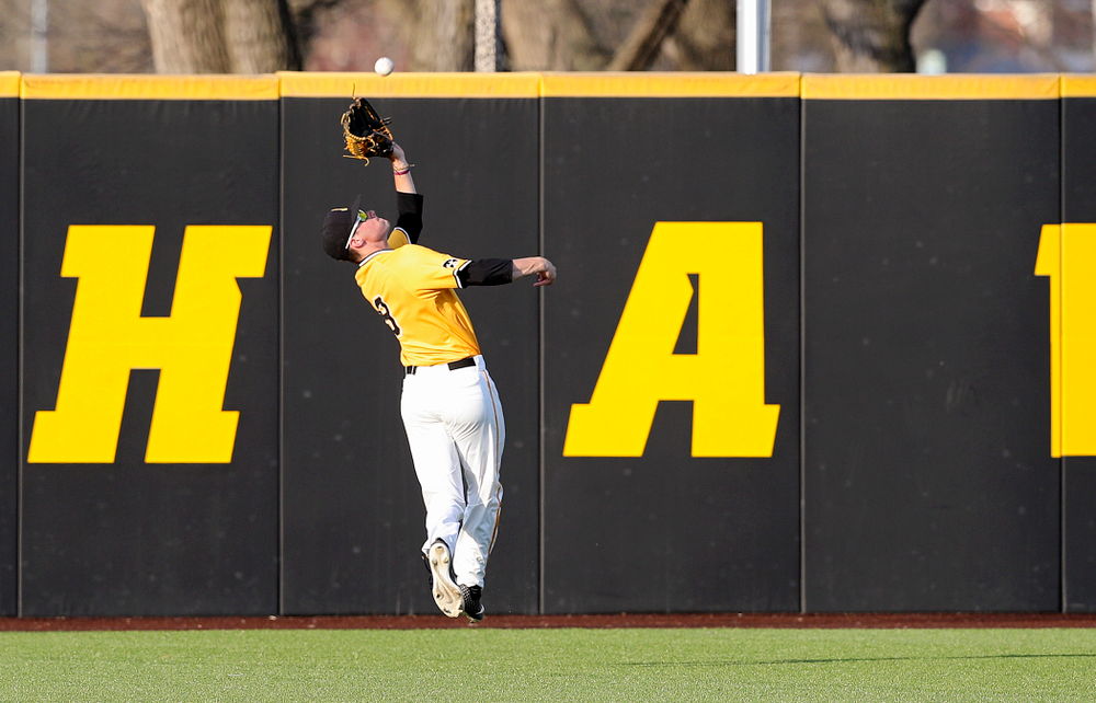 Iowa Hawkeyes center fielder Ben Norman (9) makes a catch on the run for an out during the seventh inning of their game against Northern Illinois at Duane Banks Field in Iowa City on Tuesday, Apr. 16, 2019. (Stephen Mally/hawkeyesports.com)