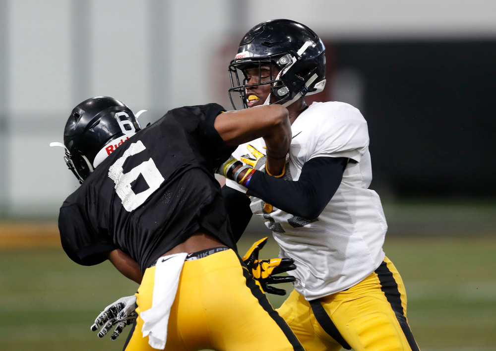 Iowa Hawkeyes wide receiver Ihmir Smith-Marsette (6) and defensive back Michael Ojemudia (11) during spring practice Wednesday, March 28, 2018 at the Hansen Football Performance Center. (Brian Ray/hawkeyesports.com)