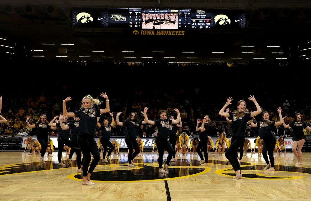 The Iowa Spirit Squad performs with participants in Spirit Squad Day at halftime of the Iowa Hawkeyes game against the Nebraska Cornhuskers Saturday, February 8, 2020 at Carver-Hawkeye Arena. (Brian Ray/hawkeyesports.com)