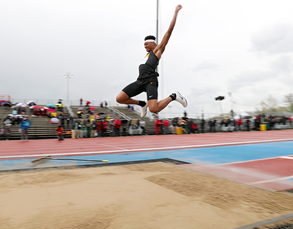 Iowa's James Carter jumps in the men’s long jump event on the second day of the Big Ten Outdoor Track and Field Championships at Francis X. Cretzmeyer Track in Iowa City on Saturday, May. 11, 2019. (Stephen Mally/hawkeyesports.com)