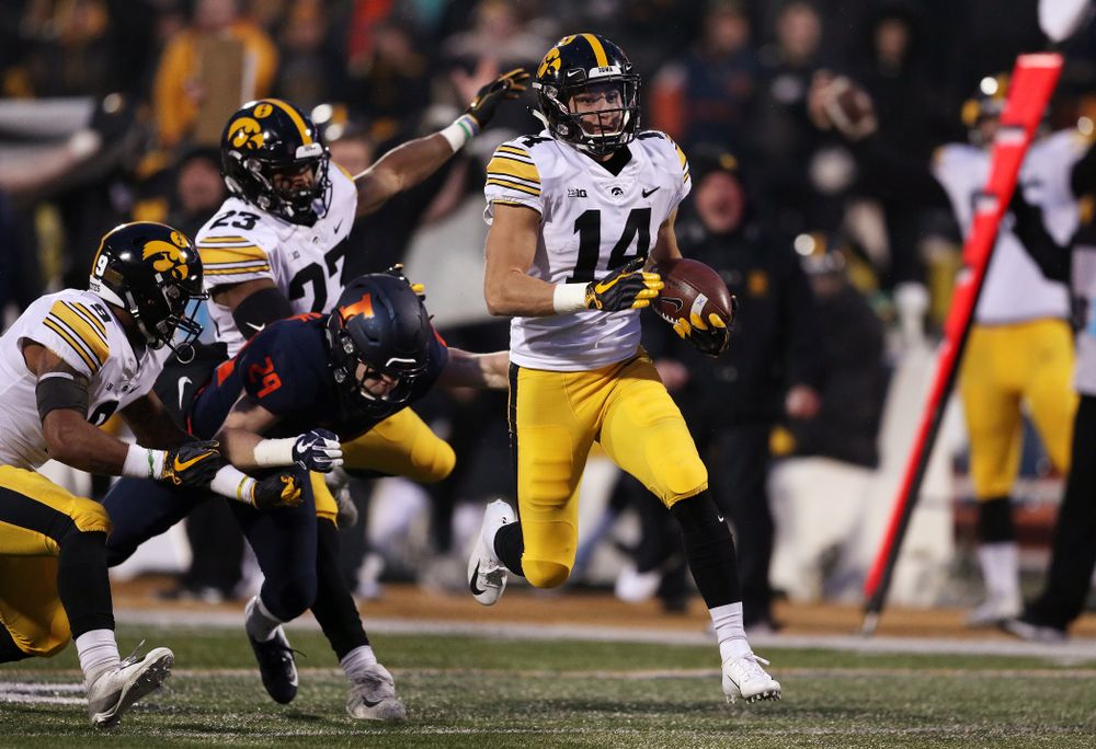 Iowa Hawkeyes wide receiver Kyle Groeneweg (14) returns a punt for a touchdown against the Illinois Fighting Illini Saturday, November 17, 2018 at Memorial Stadium in Champaign, Ill. (Brian Ray/hawkeyesports.com)