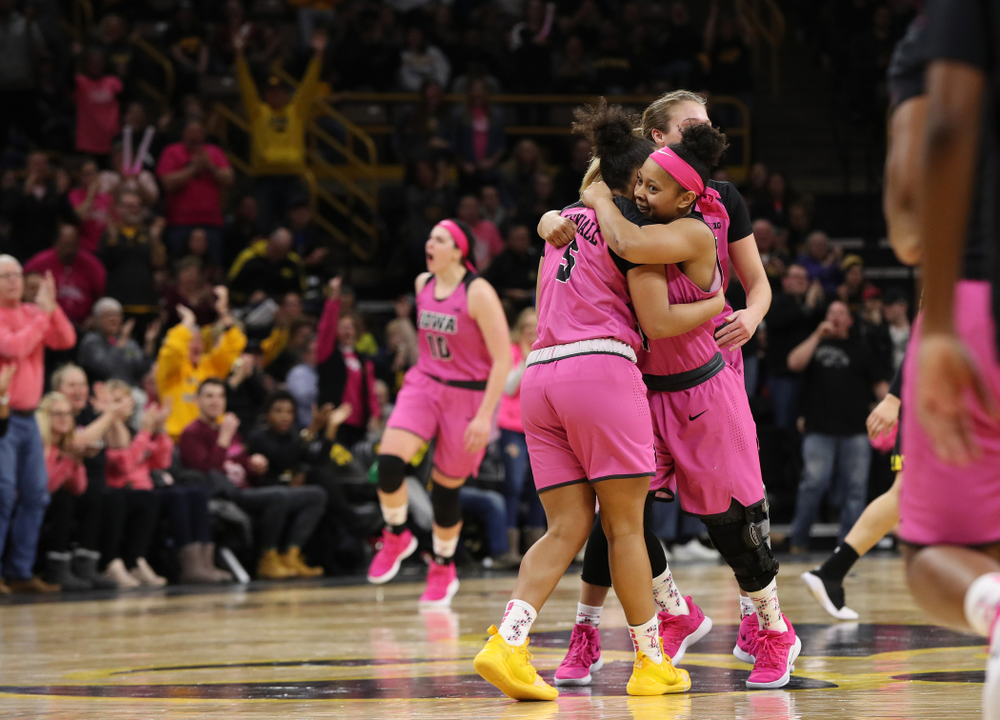 Iowa Hawkeyes guard Tania Davis (11) hugs guard Alexis Sevillian (5) after a three point basket against the seventh ranked Maryland Terrapins Sunday, February 17, 2019 at Carver-Hawkeye Arena. (Brian Ray/hawkeyesports.com)
