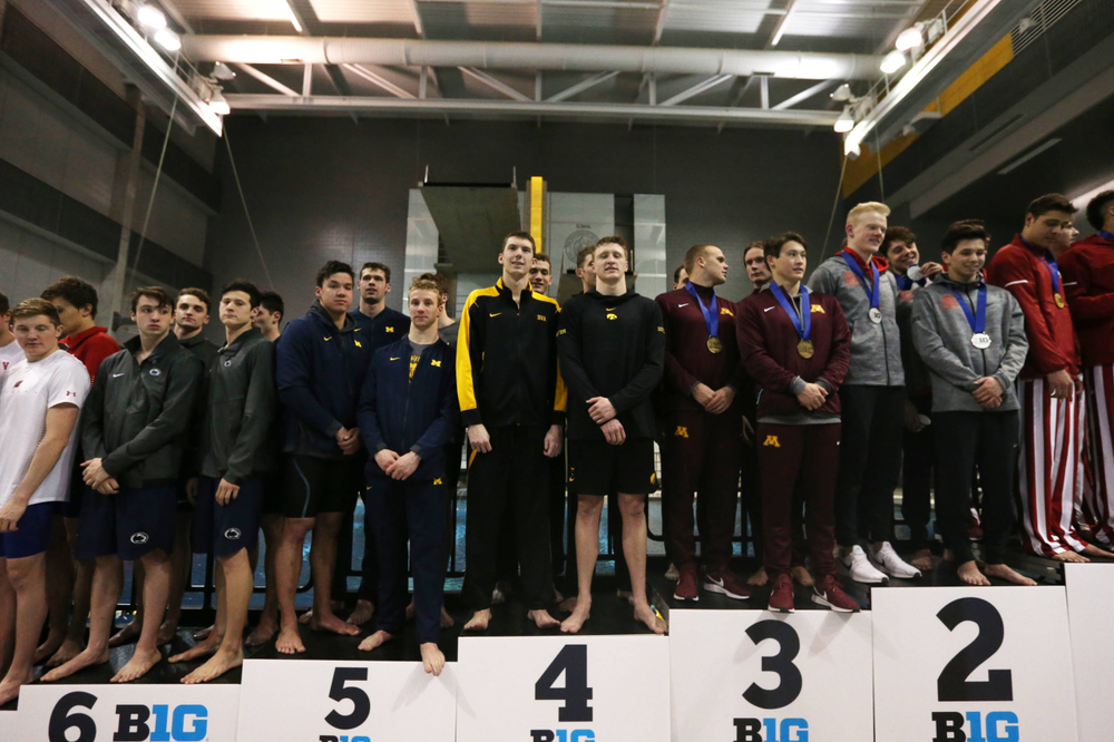 Iowa's Joe Myhre, Jack Smith, Will Scott, and Steve Fiolic after the 200-yard freestyle relay race Friday, March 1, 2019 at the Campus Recreation and Wellness Center. (Lily Smith/hawkeyesports.com)