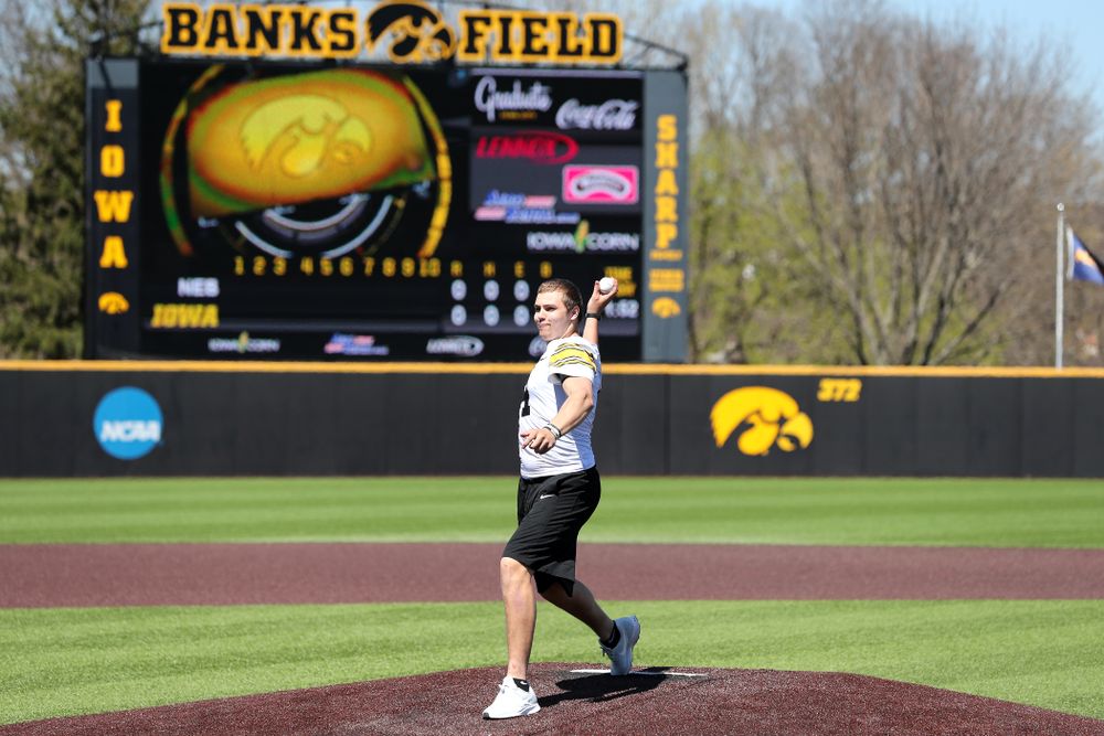 Iowa Hawkeyes quarterback Nate Stanley (4) throws out a first pitch against the Nebraska Cornhuskers Saturday, April 20, 2019 at Duane Banks Field. (Brian Ray/hawkeyesports.com)