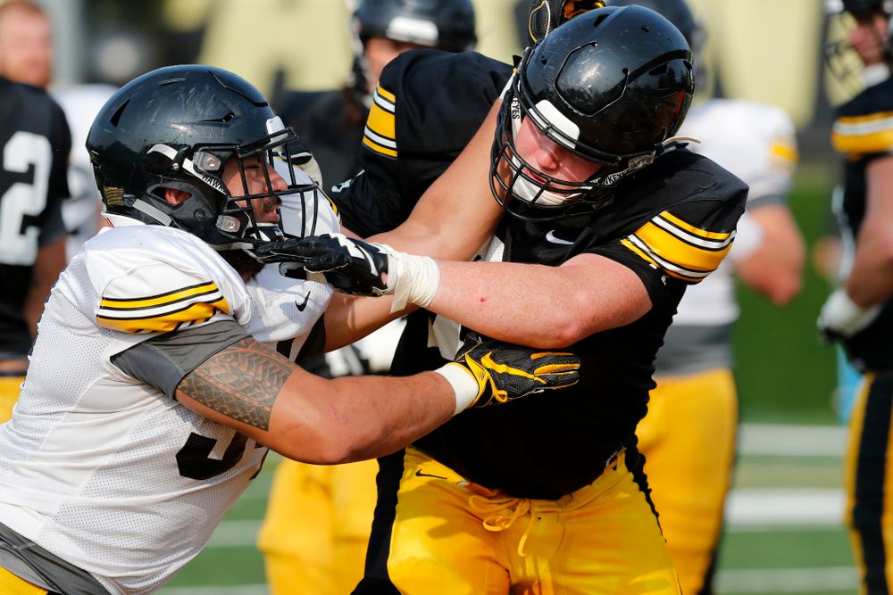 Iowa Hawkeyes defensive end A.J. Epenesa (94) and offensive lineman Mark Kallenberger (71) during camp practice No. 16 Tuesday, August 21, 2018 at the Hansen Football Performance Center. (Brian Ray/hawkeyesports.com)