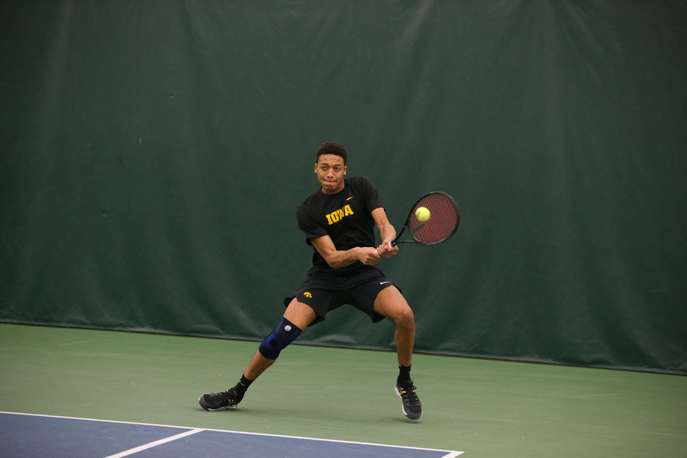 Iowa’s Oliver Okonkwo returns a ball during the Iowa men’s tennis meet vs VCU on Saturday, February 29, 2020 at the Hawkeye Tennis and Recreation Complex. (Lily Smith/hawkeyesports.com)