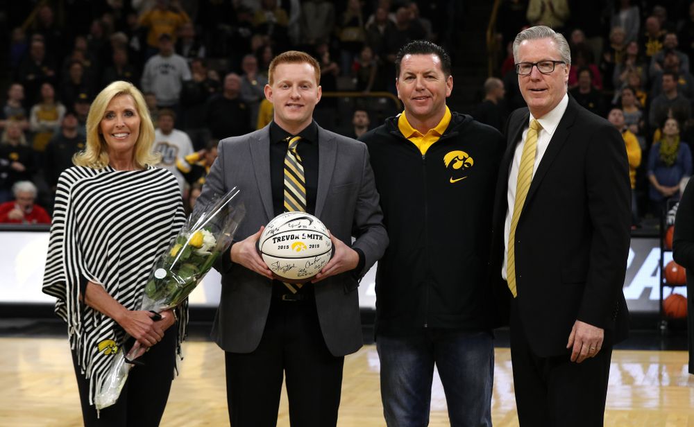 Senior Manager Trevor Smith stands with Iowa Hawkeyes head coach Fran McCaffery and his family during senior day activities before their game against the Rutgers Scarlet Knights Saturday, March 2, 2019 at Carver-Hawkeye Arena. (Brian Ray/hawkeyesports.com)