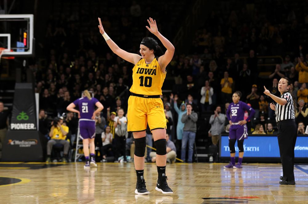 Iowa Hawkeyes forward Megan Gustafson (10) waves to the fans as she lives the court for the final time against the Northwestern Wildcats Sunday, March 3, 2019 at Carver-Hawkeye Arena. (Brian Ray/hawkeyesports.com)