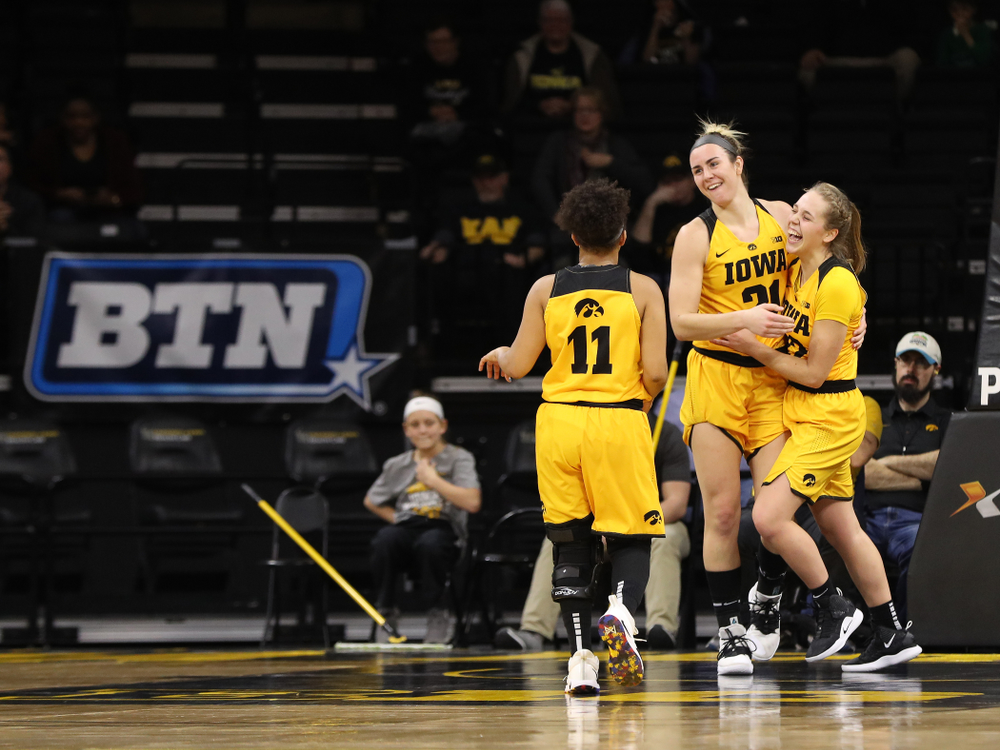 Iowa Hawkeyes forward Hannah Stewart (21) and guard Kathleen Doyle (22) against the Michigan State Spartans Thursday, February 7, 2019 at Carver-Hawkeye Arena. (Brian Ray/hawkeyesports.com)