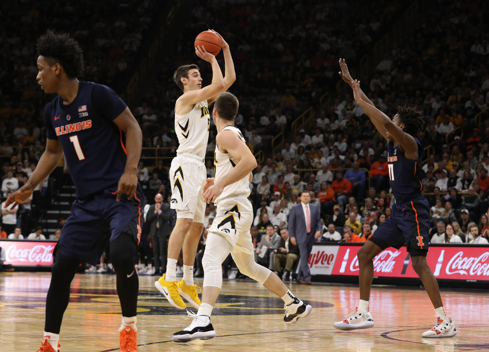 Iowa Hawkeyes forward Nicholas Baer (51) makes a three point basket against the Illinois Fighting Illini Sunday, January 20, 2019 at Carver-Hawkeye Arena. (Brian Ray/hawkeyesports.com)