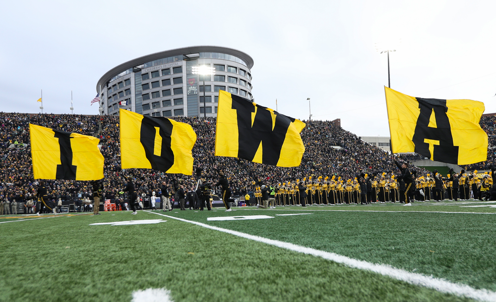The Iowa Hawkeyes football team swarms the field before a game against Northwestern at Kinnick Stadium on November 10, 2018. (Tork Mason/hawkeyesports.com)