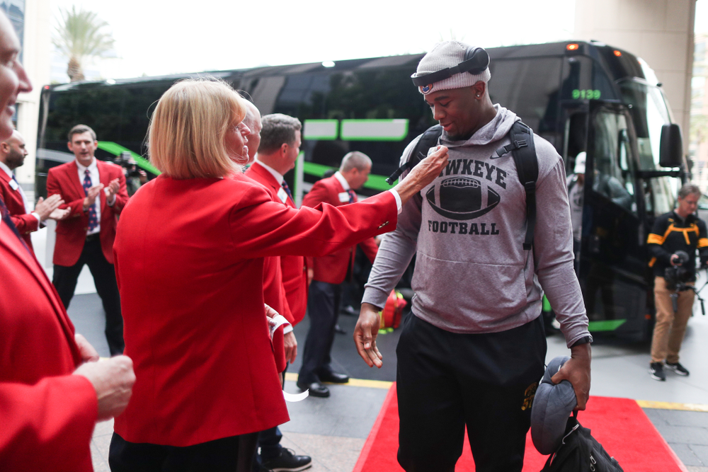 Iowa Hawkeyes defensive end Chauncey Golston (57) shakes hands with the ÒRed CoatsÓ after arriving in San Diego, CA Saturday, December 21, 2019 for the Holiday Bowl. (Brian Ray/hawkeyesports.com)
