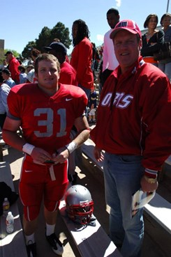 Former Lobo Mark Biren takes this photo with his son Chris after the spring game.