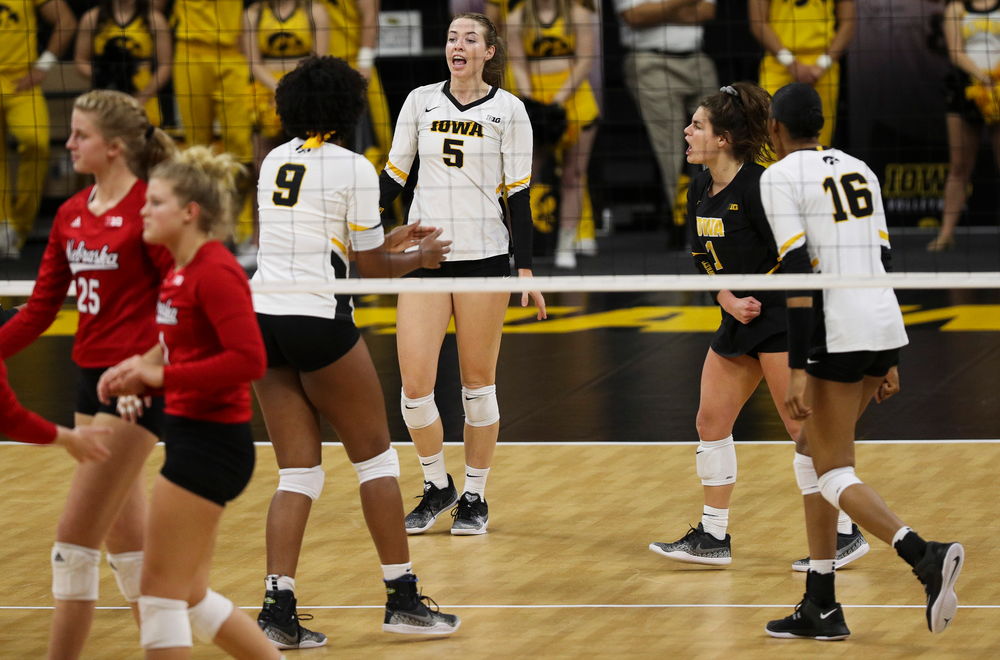Iowa Hawkeyes outside hitter Meghan Buzzerio (5) and Iowa Hawkeyes defensive specialist Molly Kelly (1) celebrate after winning a point during a match against Nebraska at Carver-Hawkeye Arena on November 7, 2018. (Tork Mason/hawkeyesports.com)
