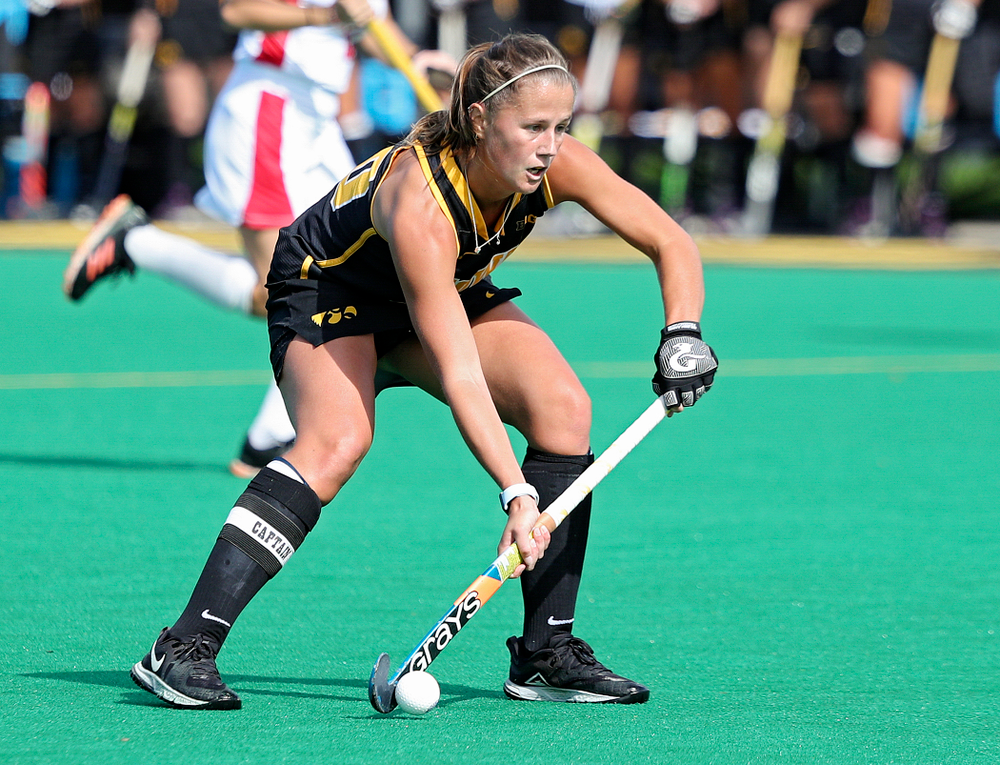 Iowa’s Sophie Sunderland (20) looks to pass during the first quarter of their match at Grant Field in Iowa City on Friday, Oct 4, 2019. (Stephen Mally/hawkeyesports.com)