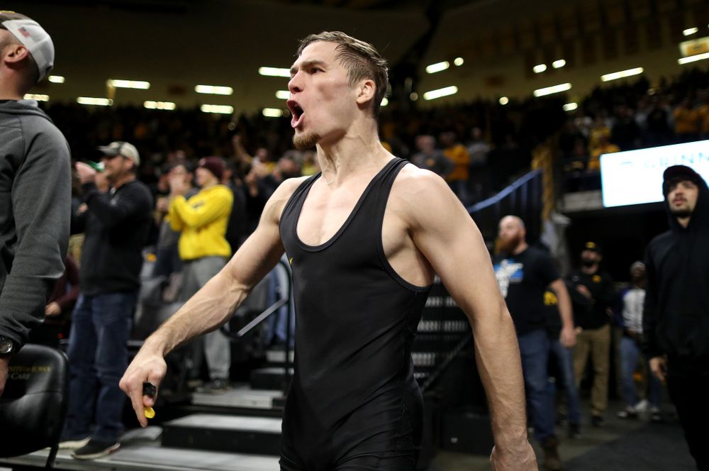 IowaÕs Spencer Lee cheers on teammate Austin DeSanto as he wrestles WisconsinÕs Seth Gross at 133 pounds Sunday, December 1, 2019 at Carver-Hawkeye Arena. DeSanto won the match 6-2. (Brian Ray/hawkeyesports.com)