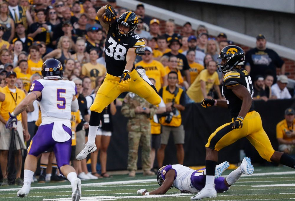Iowa Hawkeyes tight end T.J. Hockenson (38) hurdles a defender during a game against Northern Iowa at Kinnick Stadium on September 15, 2018. (Tork Mason/hawkeyesports.com)