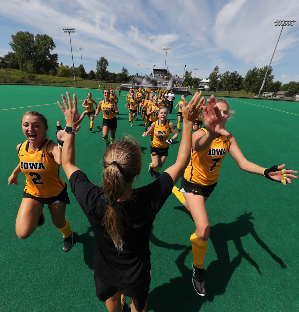 Iowa Hawkeyes defenseman Emily Deuell (2), Ellie Holley (7), and Iowa Hawkeyes assistant coach Roz Ellis during an exhibition game against Northwestern Saturday, August 24, 2019 at Grant Field. (Brian Ray/hawkeyesports.com)
