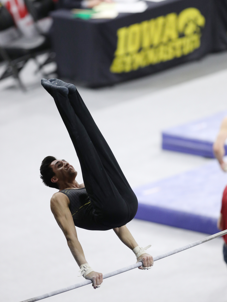 Iowa's Andrew Herrador competes on the high bar against Oklahoma Saturday, February 9, 2019 at Carver-Hawkeye Arena. (Brian Ray/hawkeyesports.com)