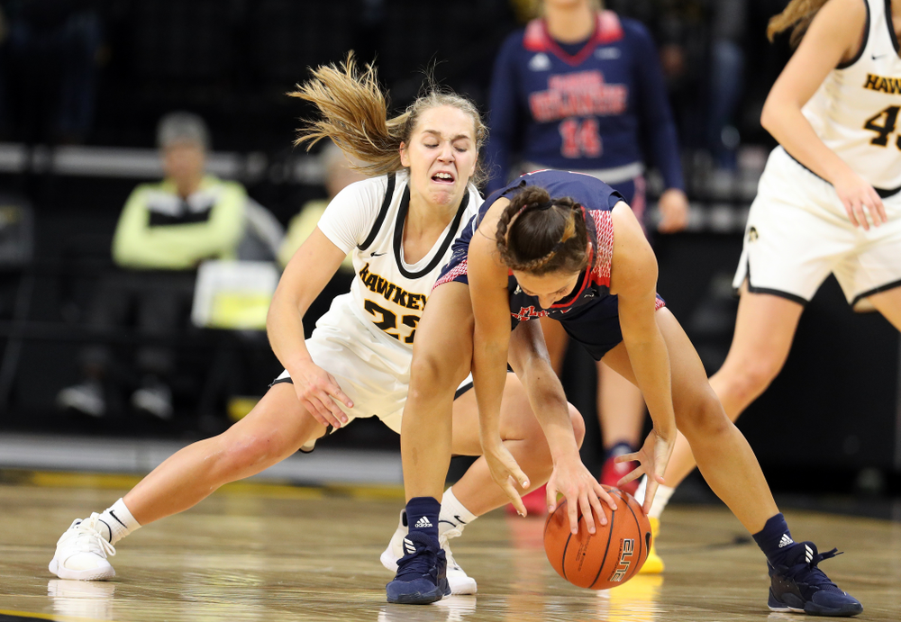 Iowa Hawkeyes guard Kathleen Doyle (22) steals the ball against Florida Atlantic University Thursday, November 7, 2019 at Carver-Hawkeye Arena. (Brian Ray/hawkeyesports.com)