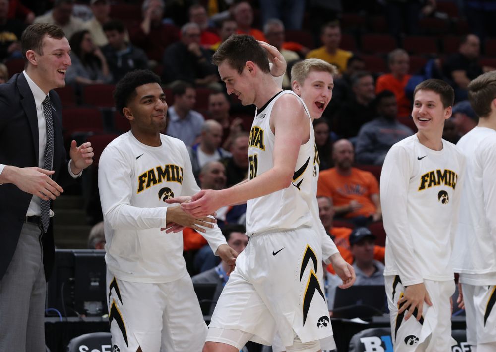 Iowa Hawkeyes forward Nicholas Baer (51) and forward Michael Baer (0) against the Illinois Fighting Illini in the 2019 Big Ten Men's Basketball Tournament Thursday, March 14, 2019 at the United Center in Chicago. (Brian Ray/hawkeyesports.com)