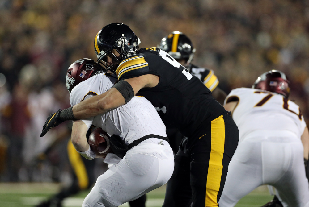 Iowa Hawkeyes defensive end A.J. Epenesa (94) gets a sack against the Minnesota Golden Gophers Saturday, November 16, 2019 at Kinnick Stadium. (Brian Ray/hawkeyesports.com)