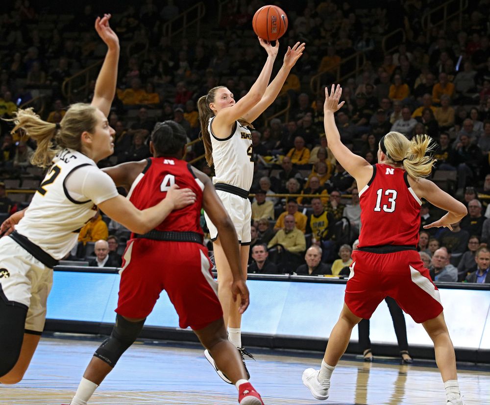 Iowa Hawkeyes forward Amanda Ollinger (43) makes a 3-pointer during the third quarter of the game at Carver-Hawkeye Arena in Iowa City on Thursday, February 6, 2020. (Stephen Mally/hawkeyesports.com)