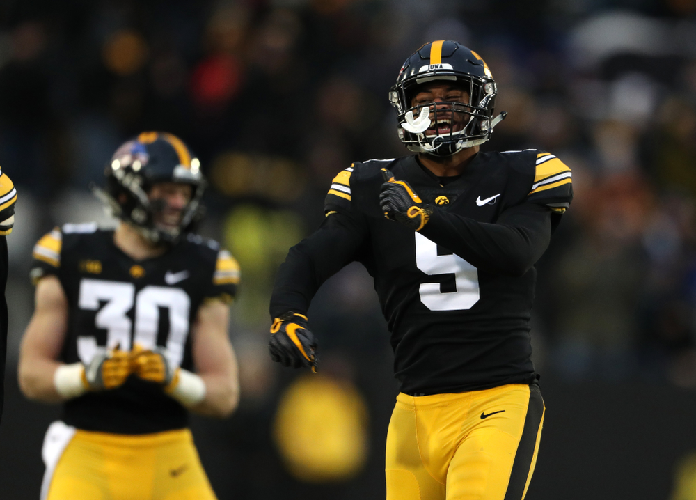 Iowa Hawkeyes defensive back Geno Stone (9) intercepts a pass against the Northwestern Wildcats Saturday, November 10, 2018 at Kinnick Stadium. (Brian Ray/hawkeyesports.com)
