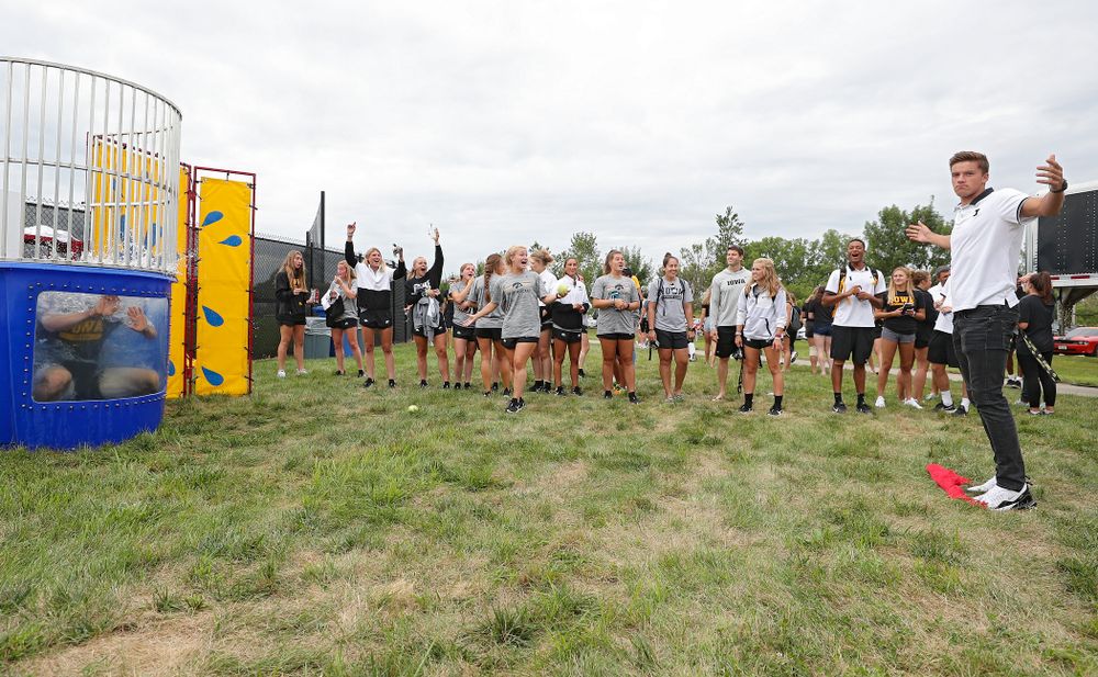 Iowa Men’s Tennis’ Joe Tyler reacts after sinking Women’s Tennis program coordinator Daniel Leitner in the dunk tank during the Student-Athlete Kickoff outside the Karro Athletics Hall of Fame Building in Iowa City on Sunday, Aug 25, 2019. (Stephen Mally/hawkeyesports.com)