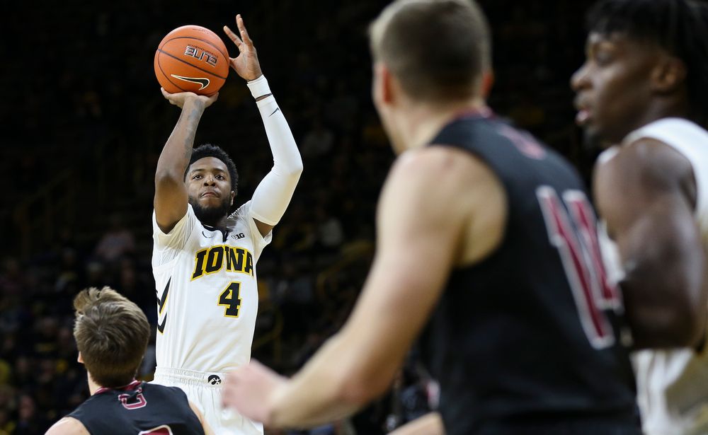 Iowa Hawkeyes guard Isaiah Moss (4) puts up a 3-pointer during a game against Guilford College at Carver-Hawkeye Arena on November 4, 2018. (Tork Mason/hawkeyesports.com)
