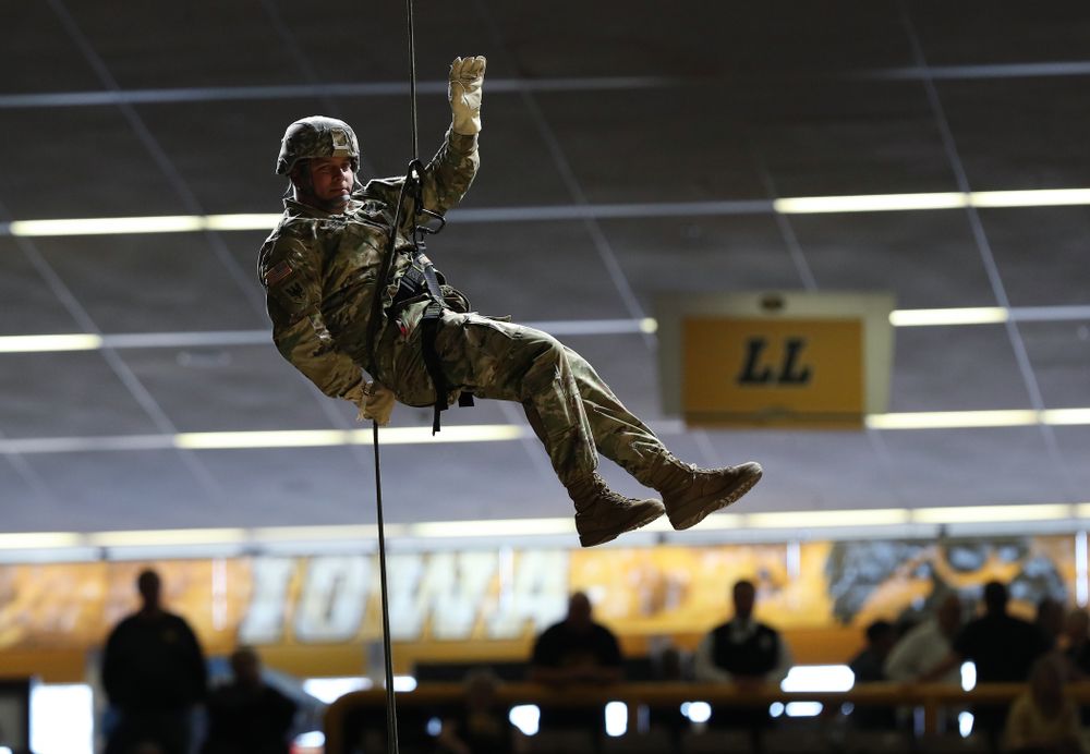 Members of the University of Iowa ROTC cadre repel down from the rafters before the Iowa Hawkeyes game against UW Green Bay Sunday, November 11, 2018 at Carver-Hawkeye Arena. (Brian Ray/hawkeyesports.com)