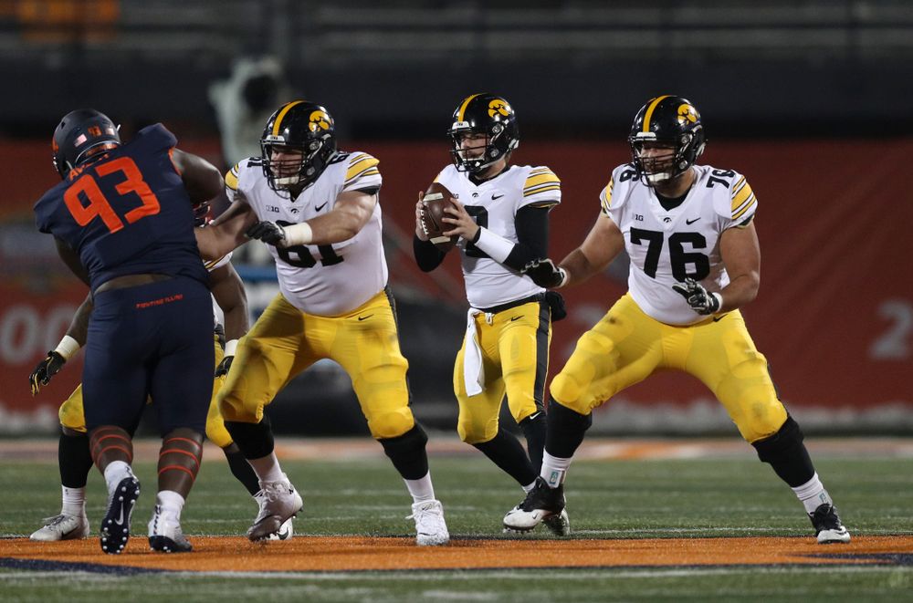 Iowa Hawkeyes quarterback Peyton Mansell (2), offensive lineman Cole Banwart (61), and offensive lineman Dalton Ferguson (76) against the Illinois Fighting Illini Saturday, November 17, 2018 at Memorial Stadium in Champaign, Ill. (Brian Ray/hawkeyesports.com)