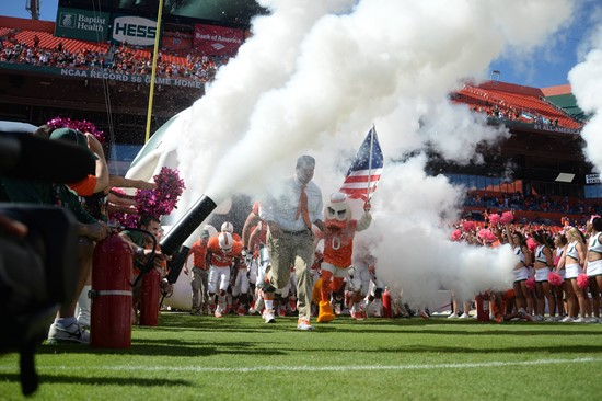 University of Miami Hurricanes head coach Al Golden leads his team on the field in a game against the Georgia Tech Yellow Jackets at Sun Life Stadium...