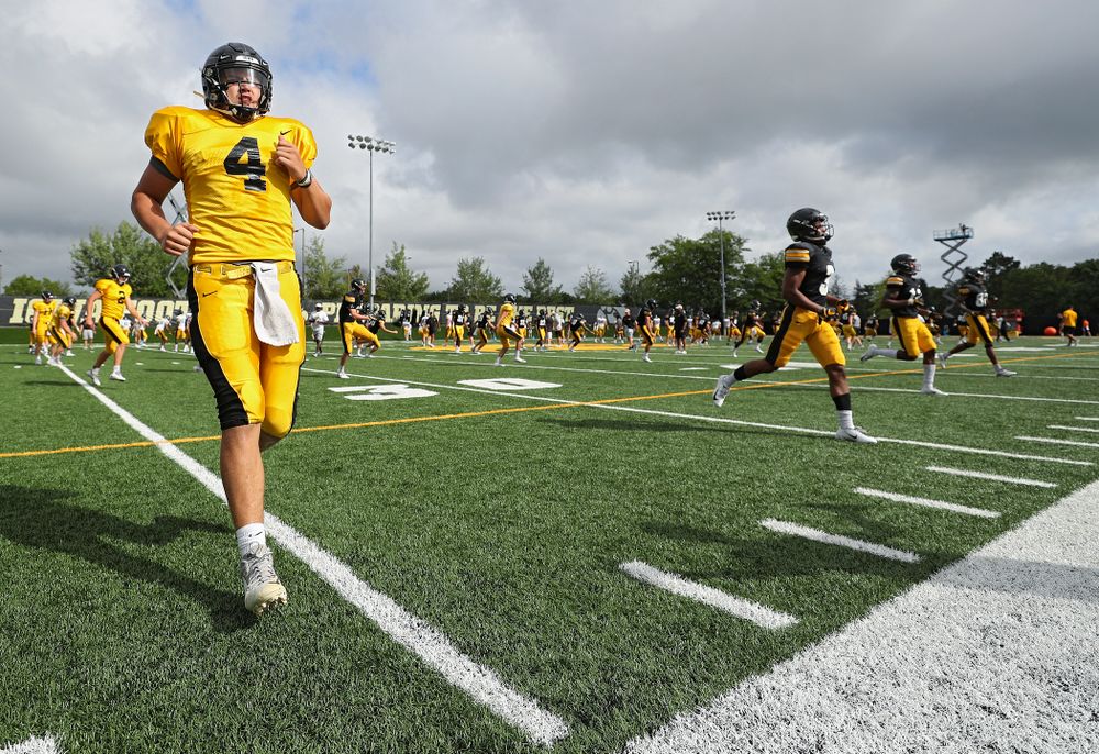 Iowa Hawkeyes quarterback Nate Stanley (4) warms up with his teammates during Fall Camp Practice No. 10 at the Hansen Football Performance Center in Iowa City on Tuesday, Aug 13, 2019. (Stephen Mally/hawkeyesports.com)