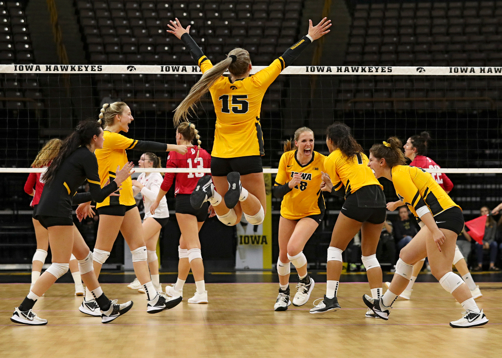 Iowa’s Halle Johnston (4), Kyndra Hansen (8), Maddie Slagle (15), Hannah Clayton (18), Brie Orr (7), and Emily Bushman (12) celebrate a score during their match at Carver-Hawkeye Arena in Iowa City on Sunday, Oct 20, 2019. (Stephen Mally/hawkeyesports.com)
