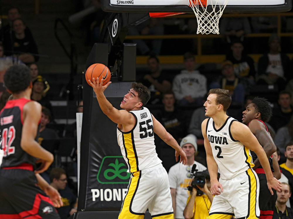 Iowa Hawkeyes center Luka Garza (55) pulls in a rebound during the second half of their game at Carver-Hawkeye Arena in Iowa City on Friday, Nov 8, 2019. (Stephen Mally/hawkeyesports.com)