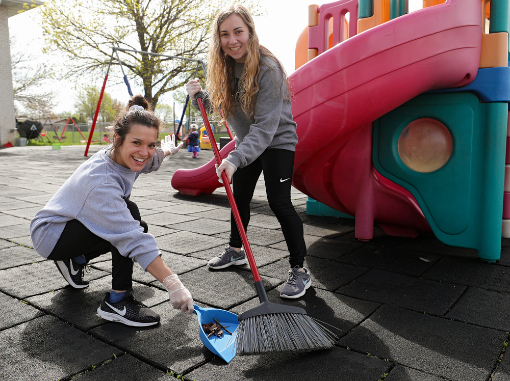 Iowa women's gymnasts clean outside Handicare during the 21st annual ISAAC Hawkeye Day of Caring in Coralville on Sunday, Apr. 28, 2019. (Stephen Mally/hawkeyesports.com)