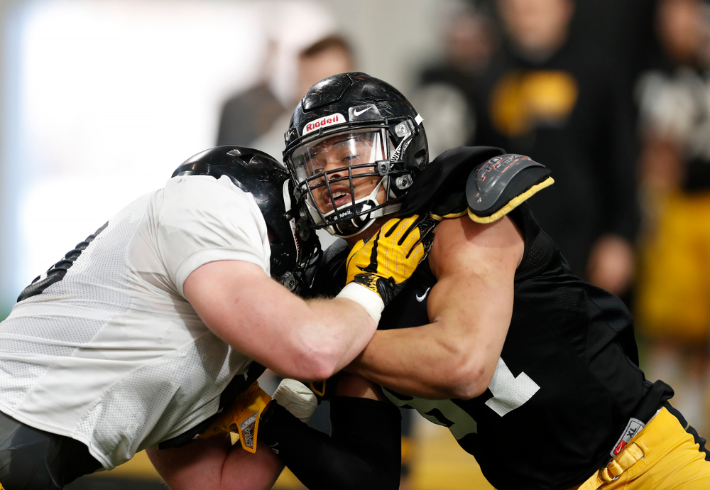 Iowa Hawkeyes tight end Noah Fant (87) and defensive end Parker Hesse (40) during spring practice Wednesday, March 28, 2018 at the Hansen Football Performance Center. (Brian Ray/hawkeyesports.com)