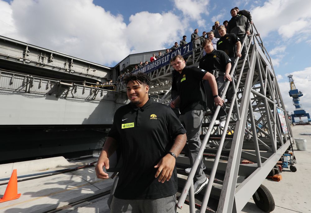 Iowa Hawkeyes offensive lineman Tristan Wirfs (74) leaves the USS Theodore Roosevelt (CVN-71) Tuesday, December 24, 2019 at the Naval Base Coronado (Brian Ray/hawkeyesports.com)