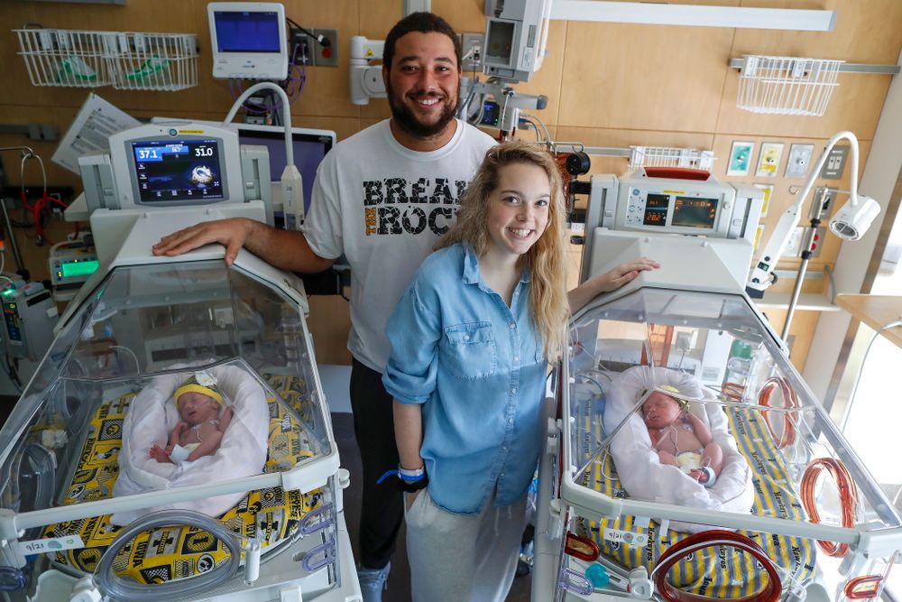 Iowa Hawkeyes offensive lineman Dalton Ferguson (76) and his girlfriend Rachael stand with their newborn twins Ella and Hazel Wednesday, September 12, 2018 in the NICU at the Stead Family Children's Hospital (Brian Ray/hawkeyesports.com)