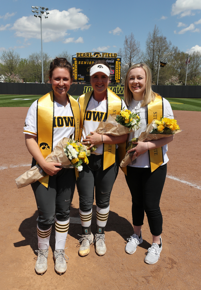 Iowa Hawkeyes seniors Mallory Kilian (11), Erin Riding (6) and Brooke Rozier pose for a photo during senior day festivities following their game against the Ohio State Buckeyes on senior day Sunday, May 5, 2019 at Pearl Field. (Brian Ray/hawkeyesports.com)