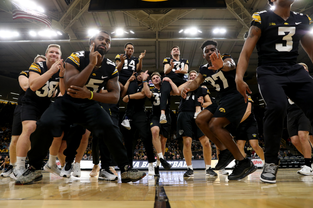 Members of the Hawkeye Football team performs with the Iowa Dance Team at halftime of the Iowa Hawkeyes game against the Ohio State Buckeyes Thursday, February 20, 2020 at Carver-Hawkeye Arena. (Brian Ray/hawkeyesports.com)