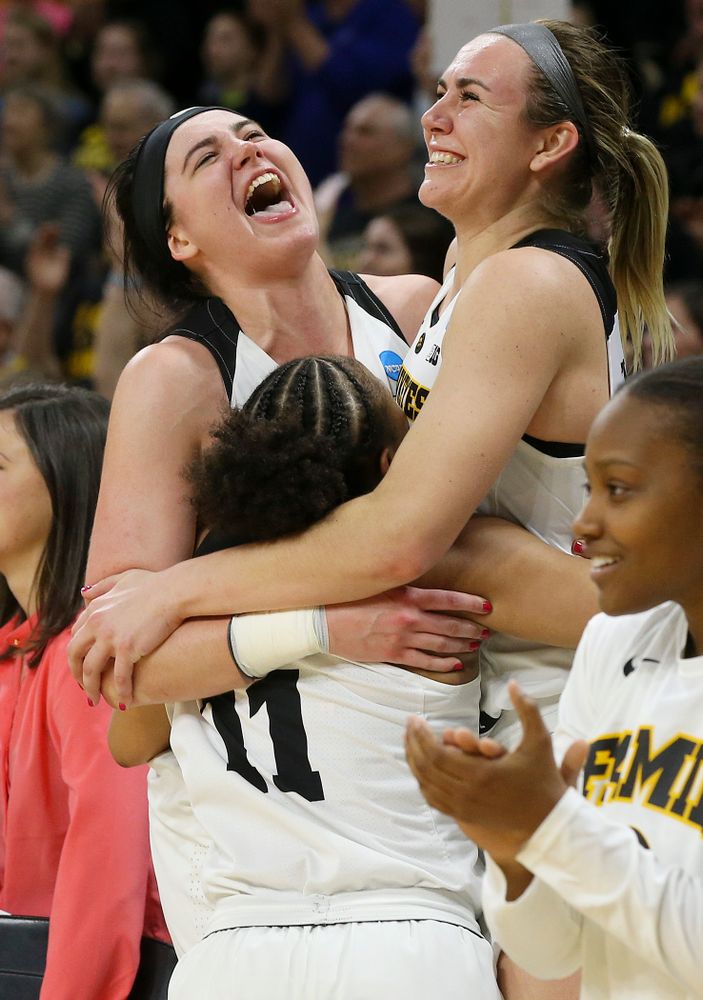 Iowa Hawkeyes guard Tania Davis (11), center Megan Gustafson (10), and forward Hannah Stewart (21) celebrate after winning their second round game in the 2019 NCAA Women's Basketball Tournament at Carver Hawkeye Arena in Iowa City on Sunday, Mar. 24, 2019. (Stephen Mally for hawkeyesports.com)