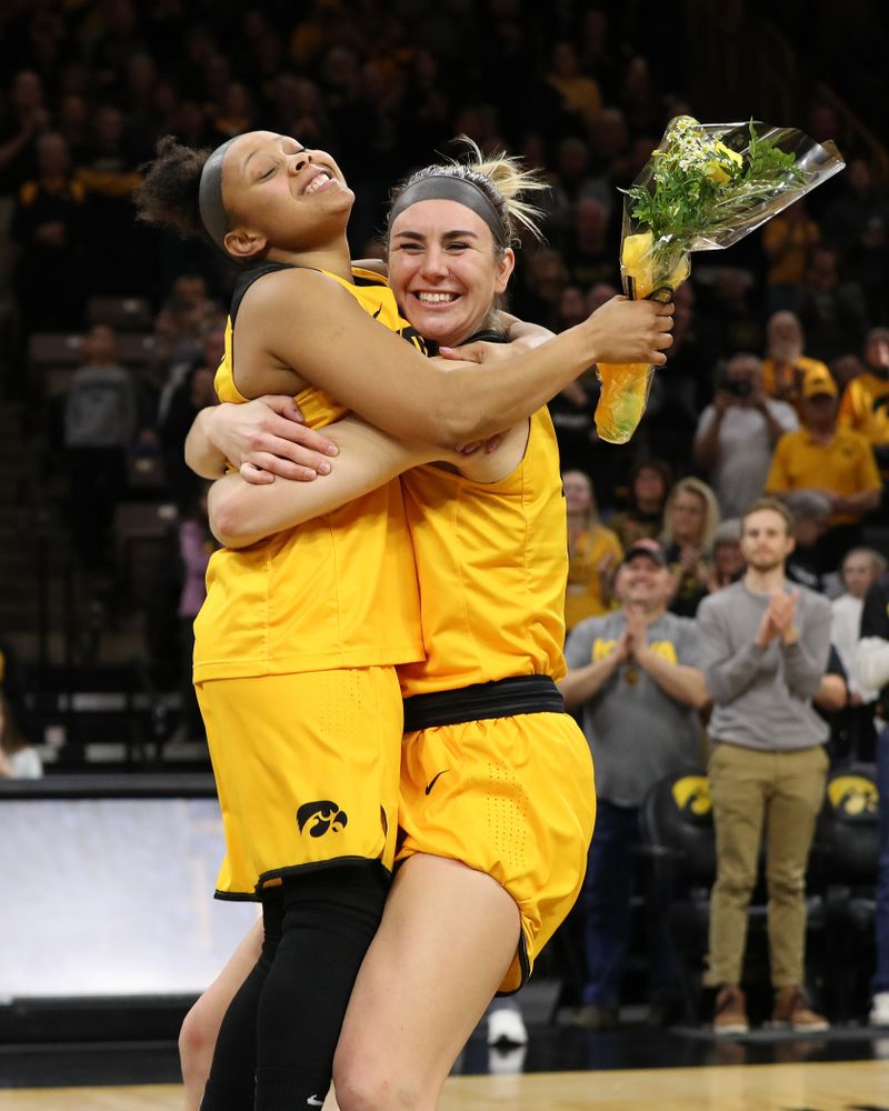 Iowa Hawkeyes guard Tania Davis (11) and forward Hannah Stewart (21) during senior day ceremonies following their game against the Northwestern Wildcats Sunday, March 3, 2019 at Carver-Hawkeye Arena. (Brian Ray/hawkeyesports.com)